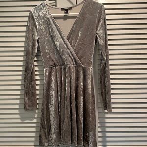 Silver long sleeved flare dress with a low cut top